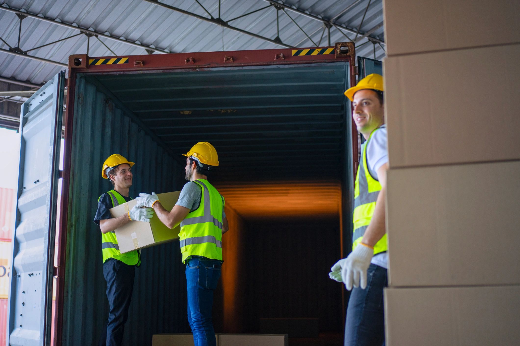 Warehouse operations team handling logistics for sensitive equipment